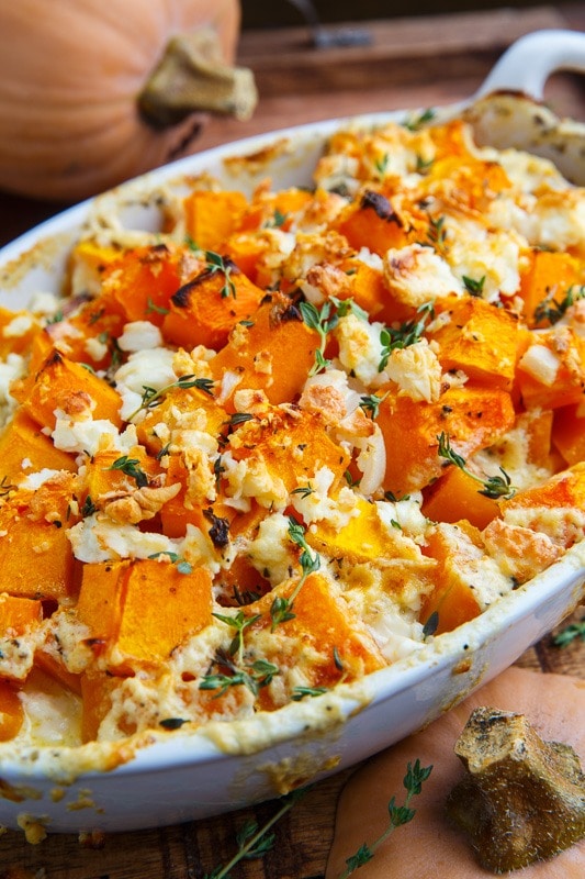 Butternut squash gratin with feta on a baking dish.