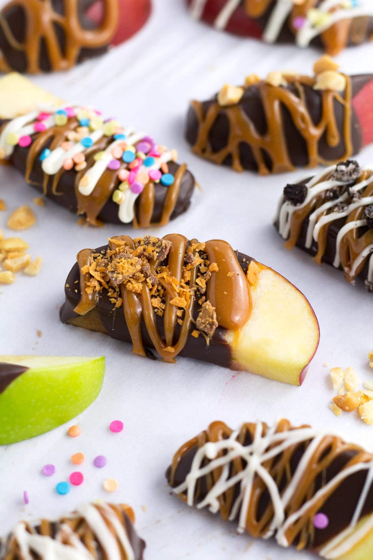 Apples coated with chocolate and caramel; syrup