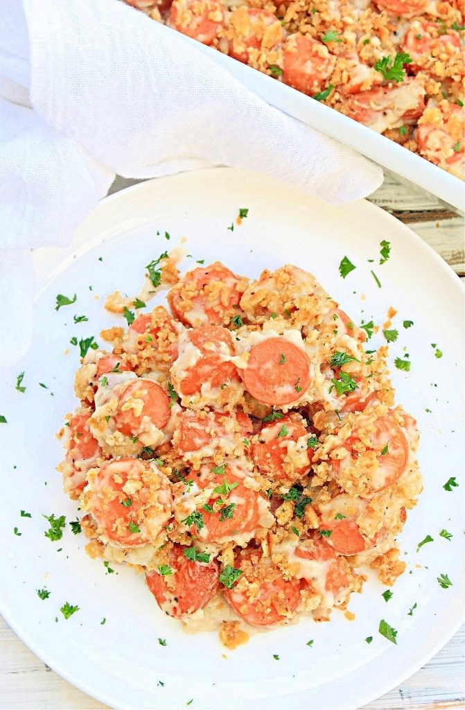 Carrots Au Gratin serving on a white plate. 