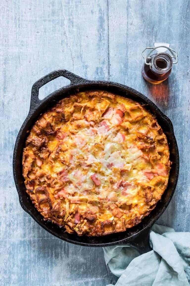 Cheesy Waffle And Ham Breakfast Casserole on a cast iron