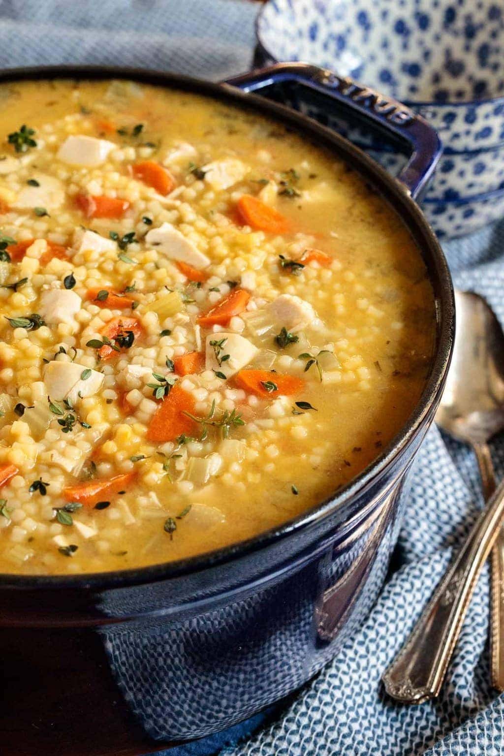 A pot of chicken pasta soup. 