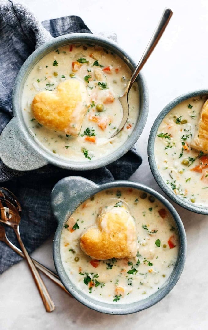 Top view of three bowls of chicken pot pie soup. 