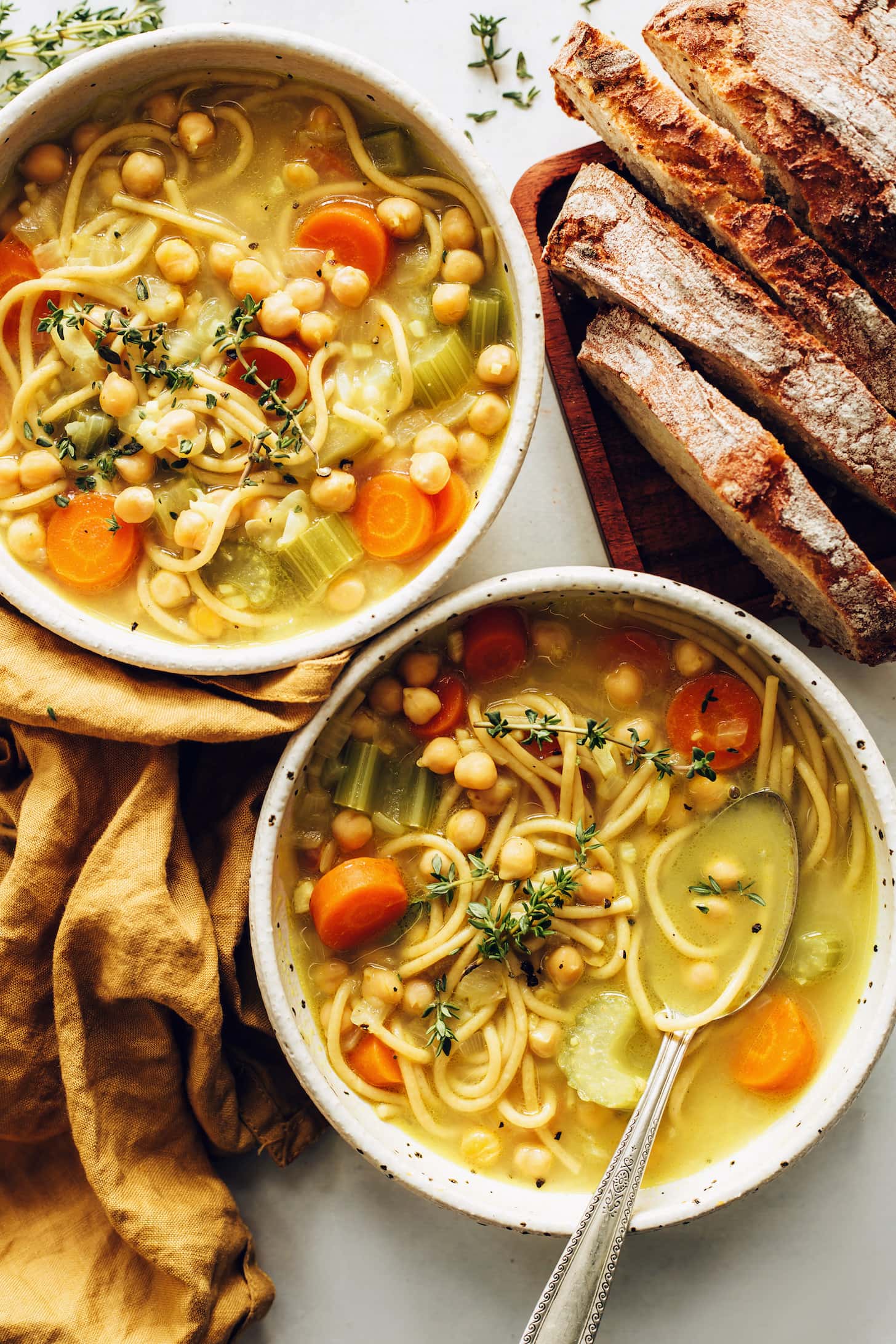 Chickpea Noodle Soup with Celery and Carrots Served with Bread