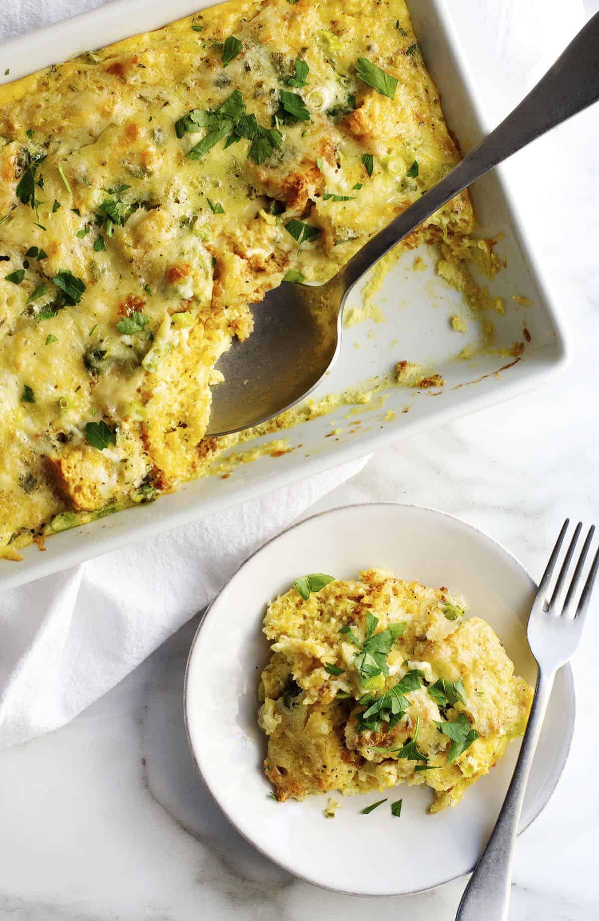 Egg casserole topped with spinach and cheese.