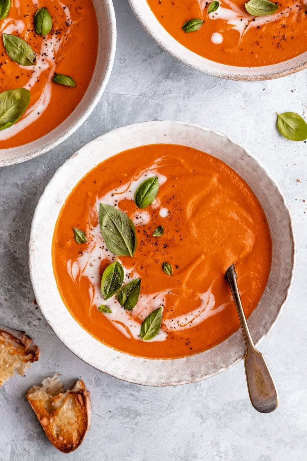 Homemade Creamy Vegan Tomato Soup Served with Garlic Bread