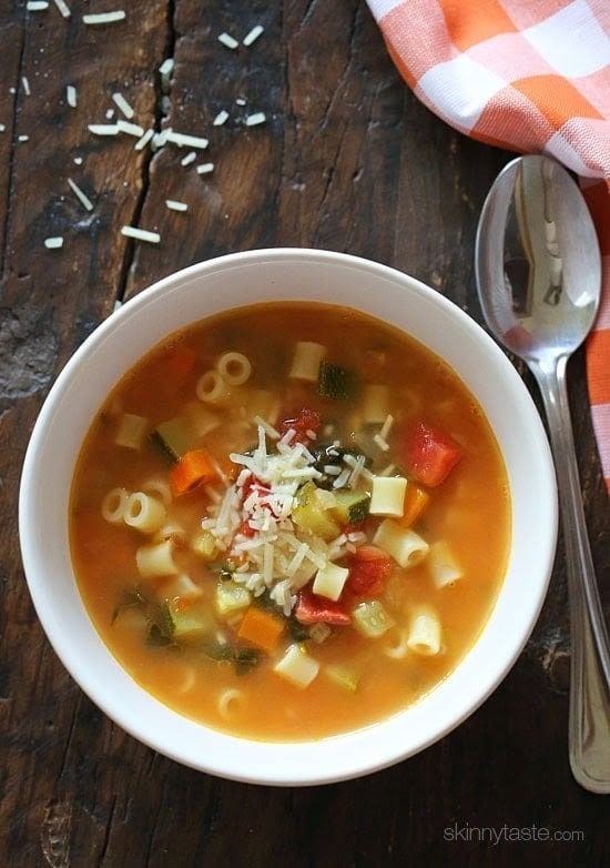 Top view of a bowl of minestrone soup made with pureed beans with carrots, celery, onion, and garlic. 