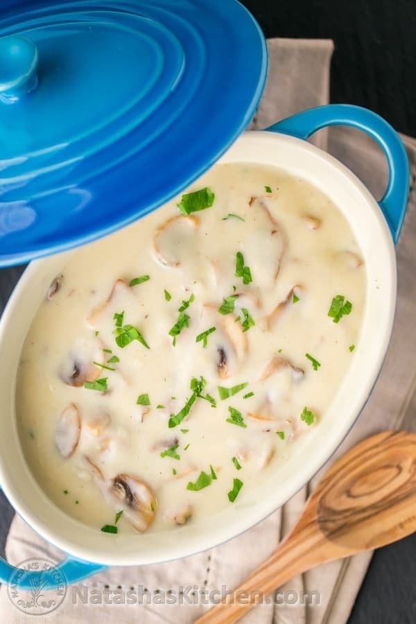 Mushroom gravy cooked on a blue pot. 