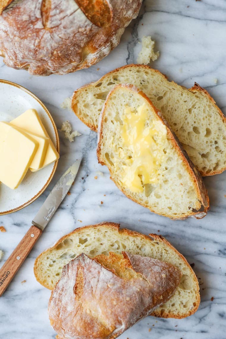 Sliced no-knead bread with butter. 