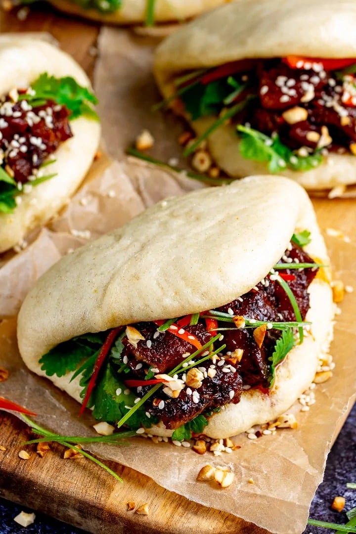 Gua Bao (Pork Belly Bao Buns) garnished with sesame seeds