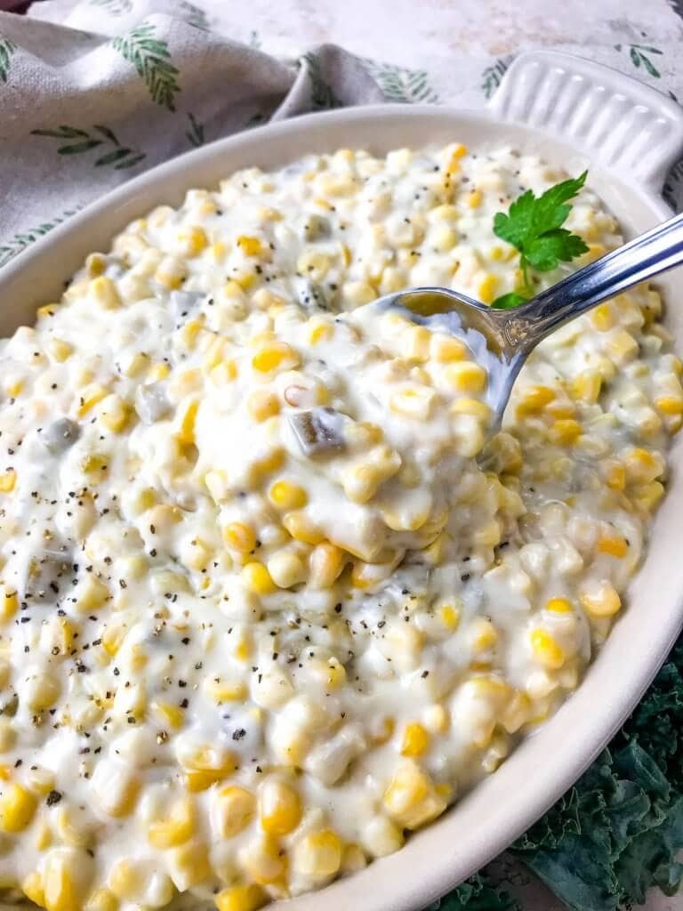 Hatch Green Chile Creamed Corn served with a spoon.