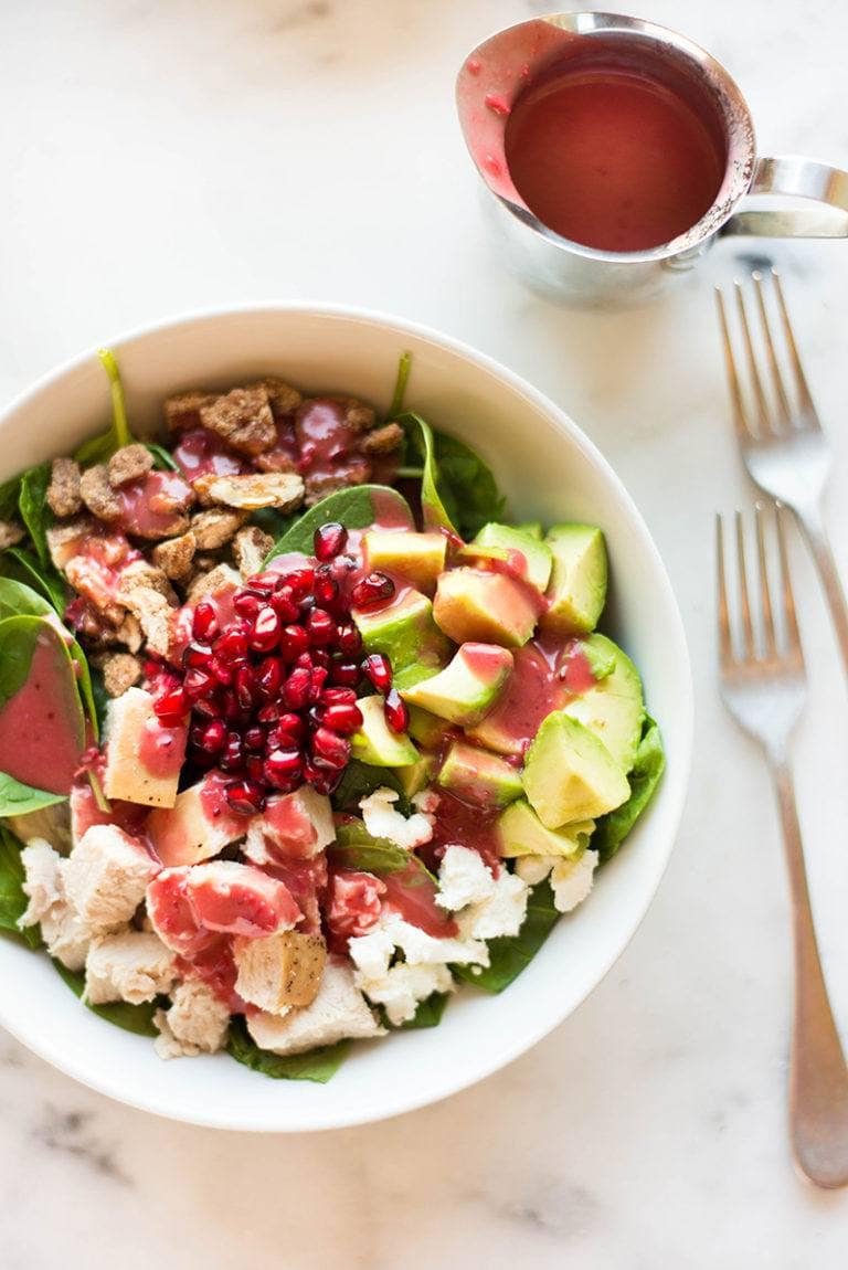 A bowl of leftover turkey salad with cranberry vinaigrette. 