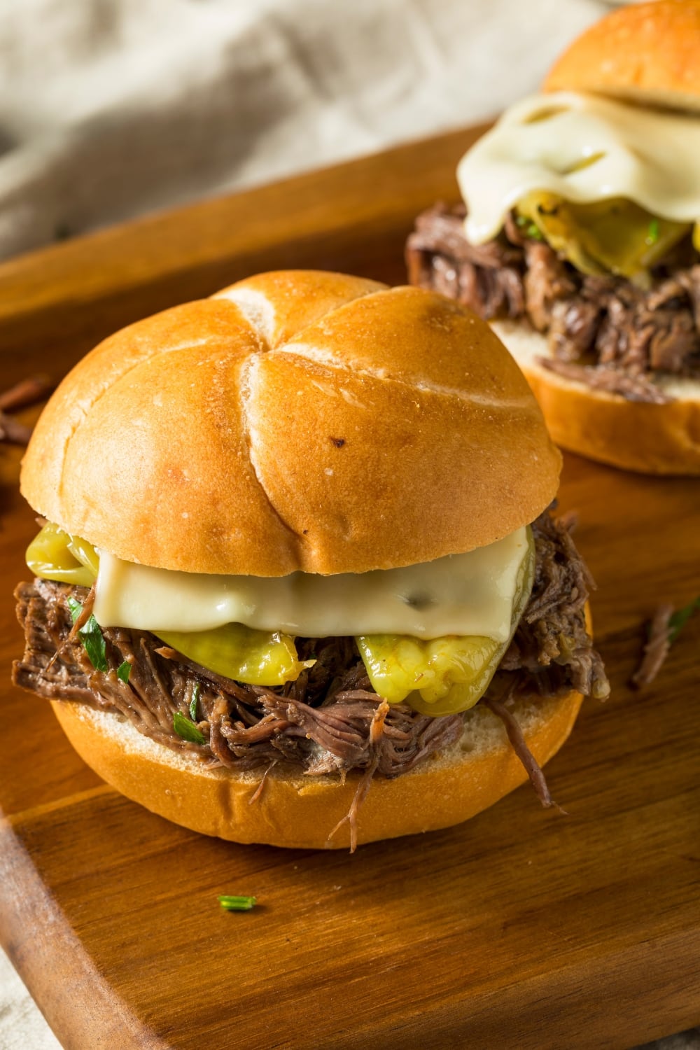 Buns with Mississippi Pot Roast filling and melted cheese. 