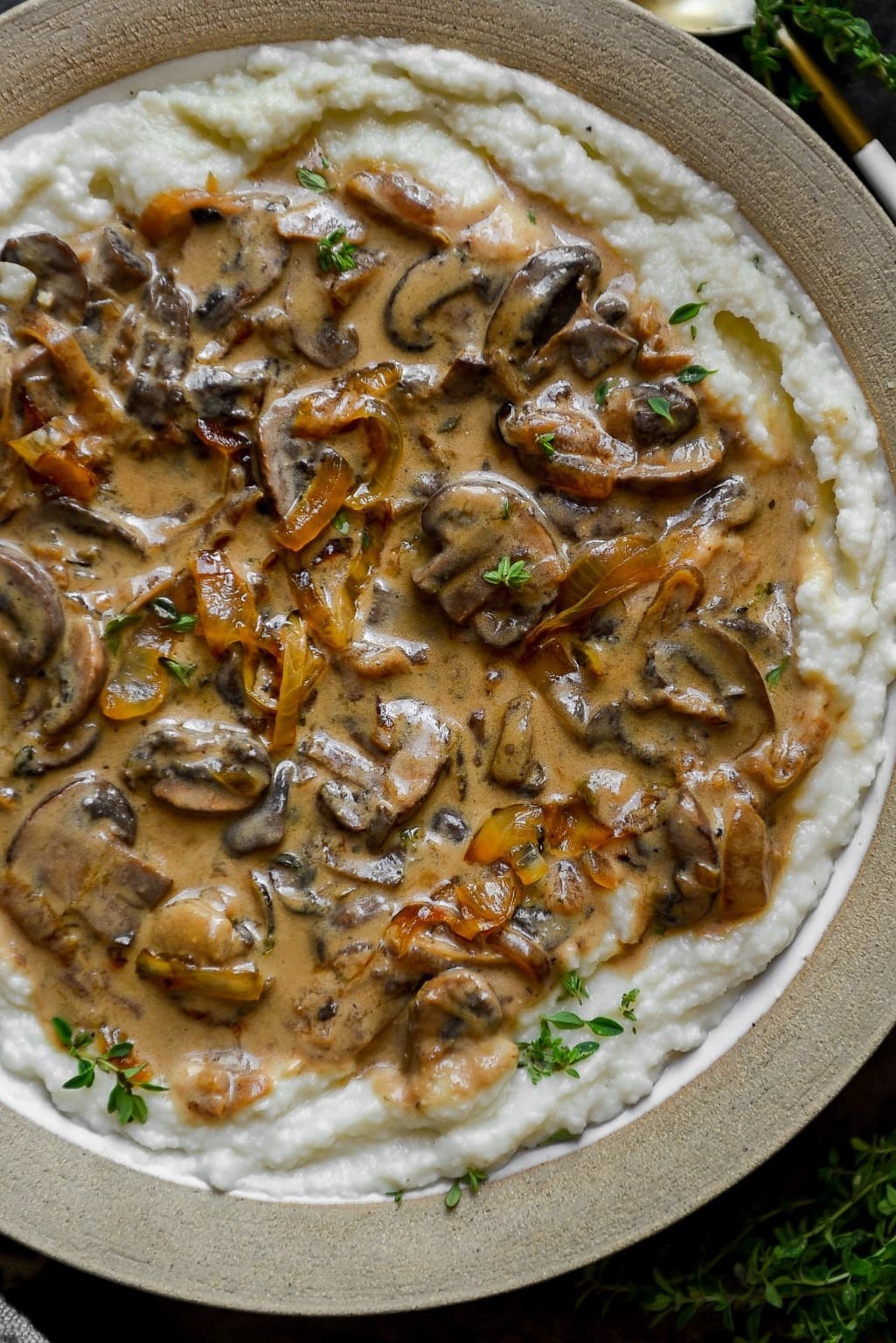 Mushroom stroganoff with mashed cauliflower topped on mashed potatoes. 