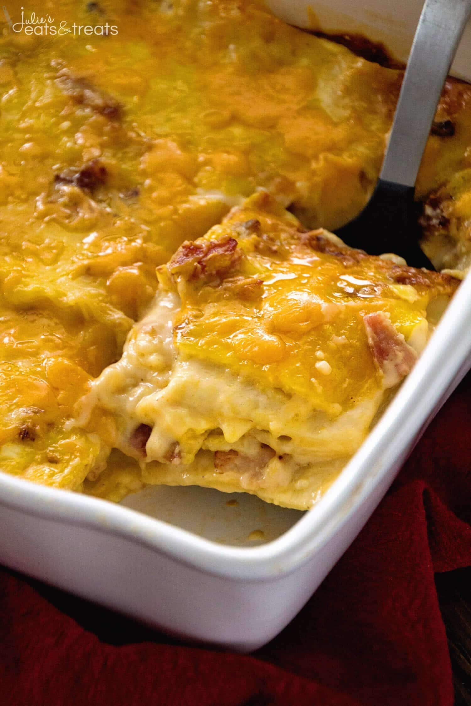 Ladle scooping a slice of Overnight Breakfast Lasagna