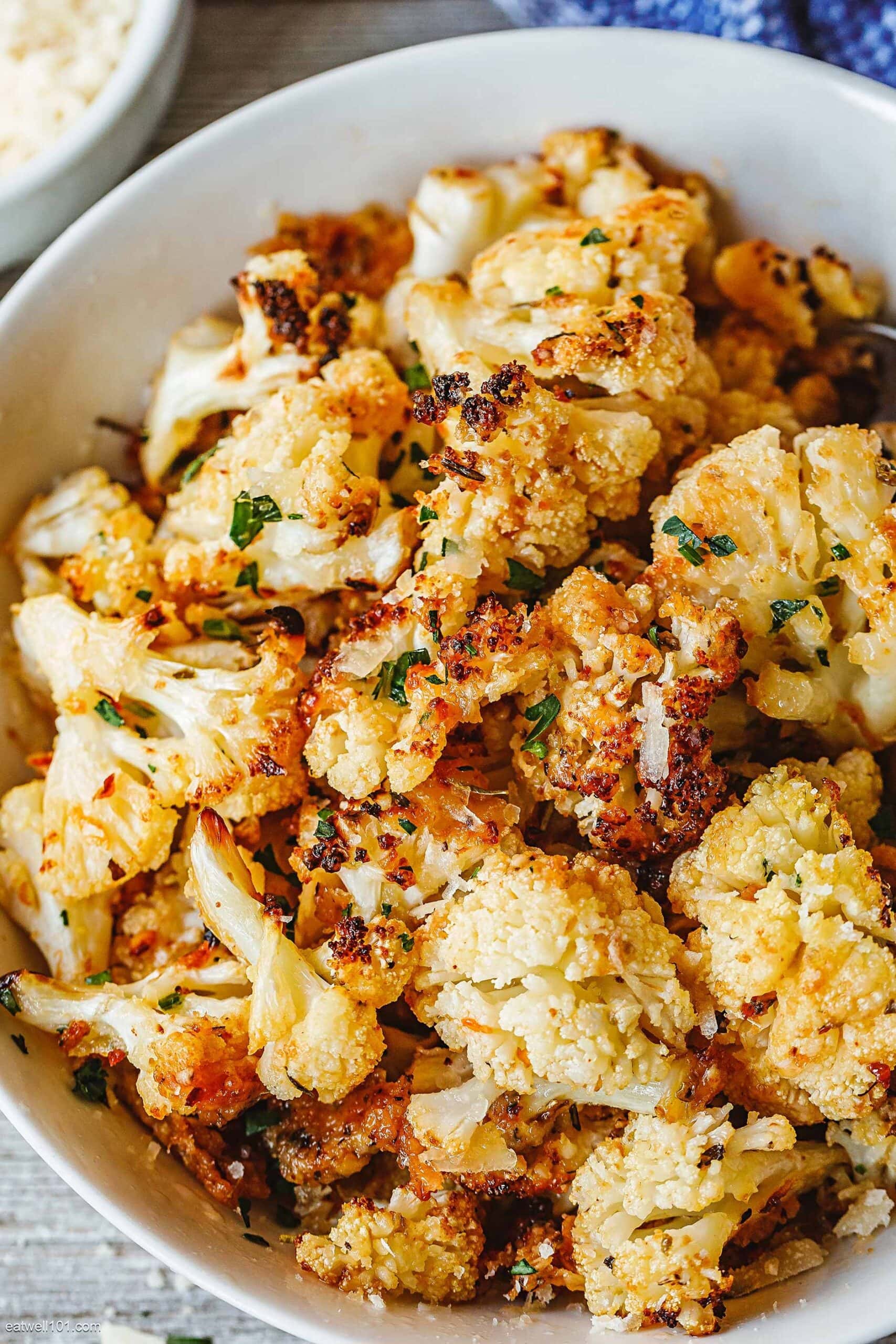 Garlic parmesan roasted cauliflower in a bowl. 