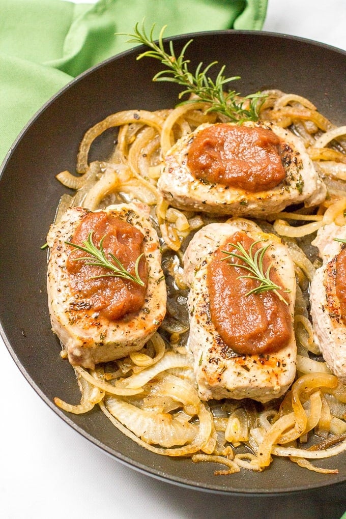 Pork chops sauteed with white onions served with apple butter. 