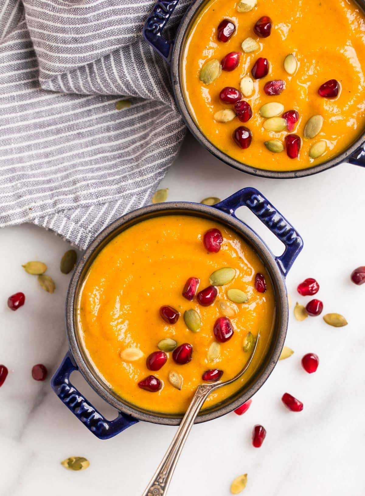 Bowls of homemade Pumpkin Soup with pumpkin seeds