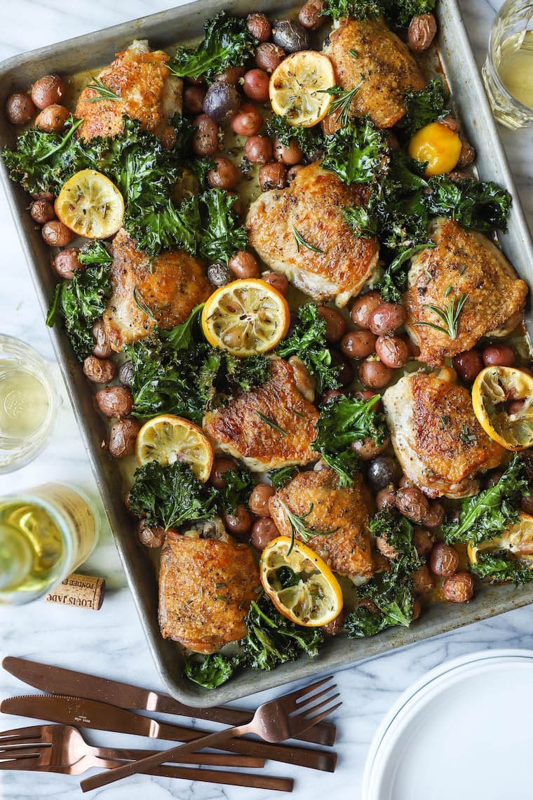 Chicken cooked with lemon, rosemary and baby potatoes in a sheet pan. 