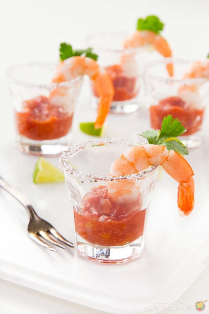 Shrimp cocktail shooters on shot glass. 