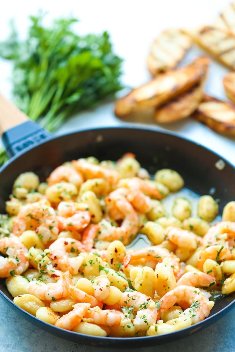 Buttery shrimp scampi gnocchi cooked on a pan