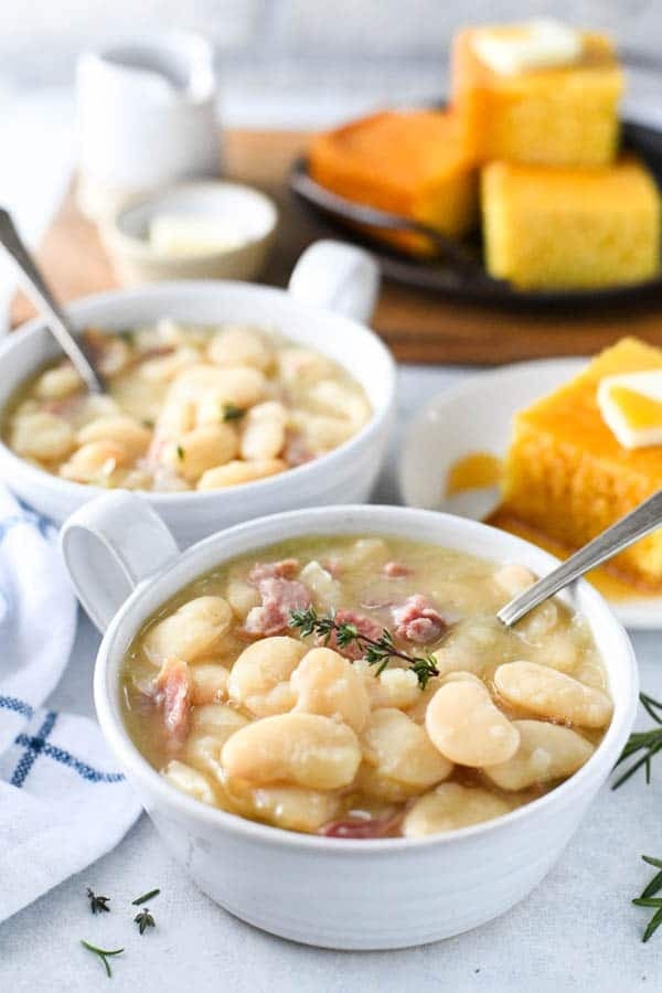 Sothern Lima beans with ham served on small bowl with spoon. 