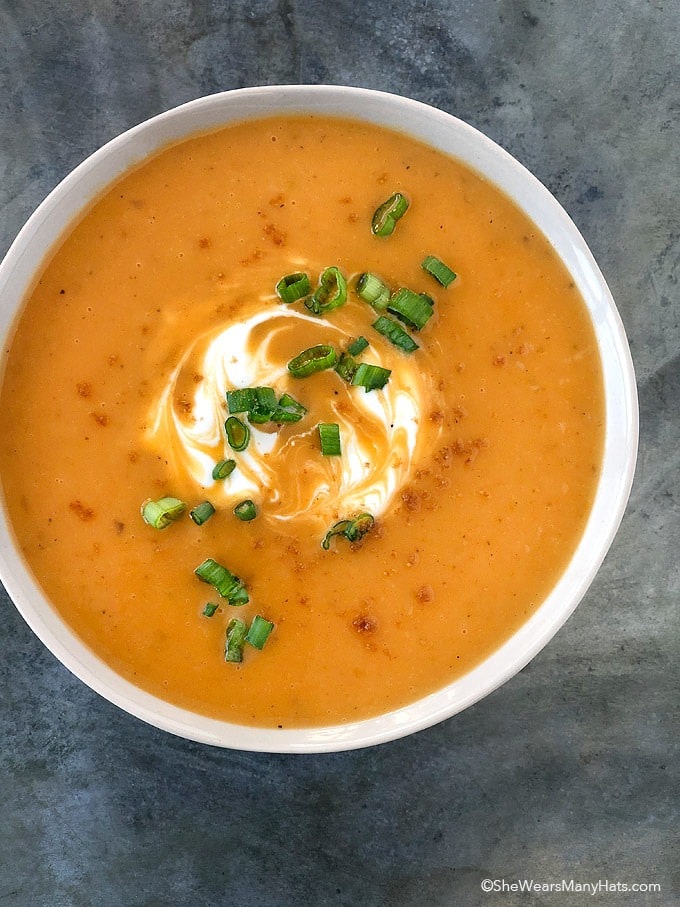 Bowl of Sweet Potato Soup garnished with green onions