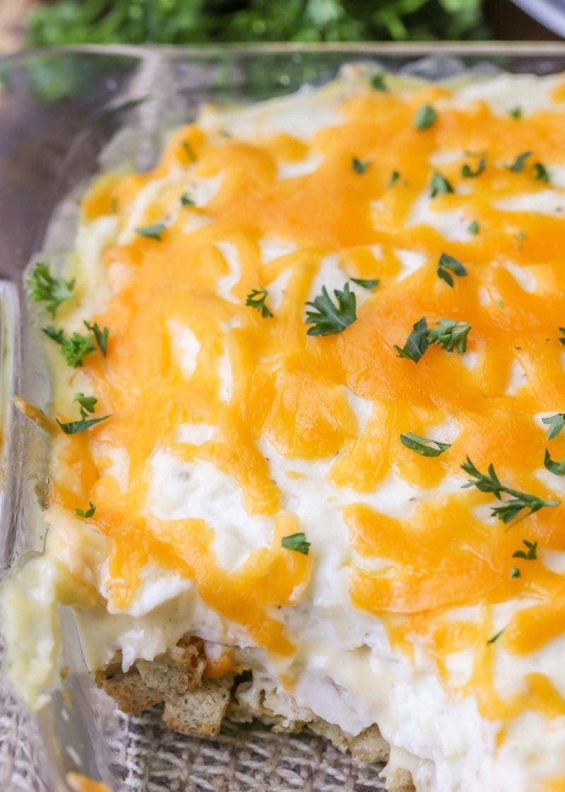 Chicken casserole with melted cheese and aromatic herbs, served in a baking dish.