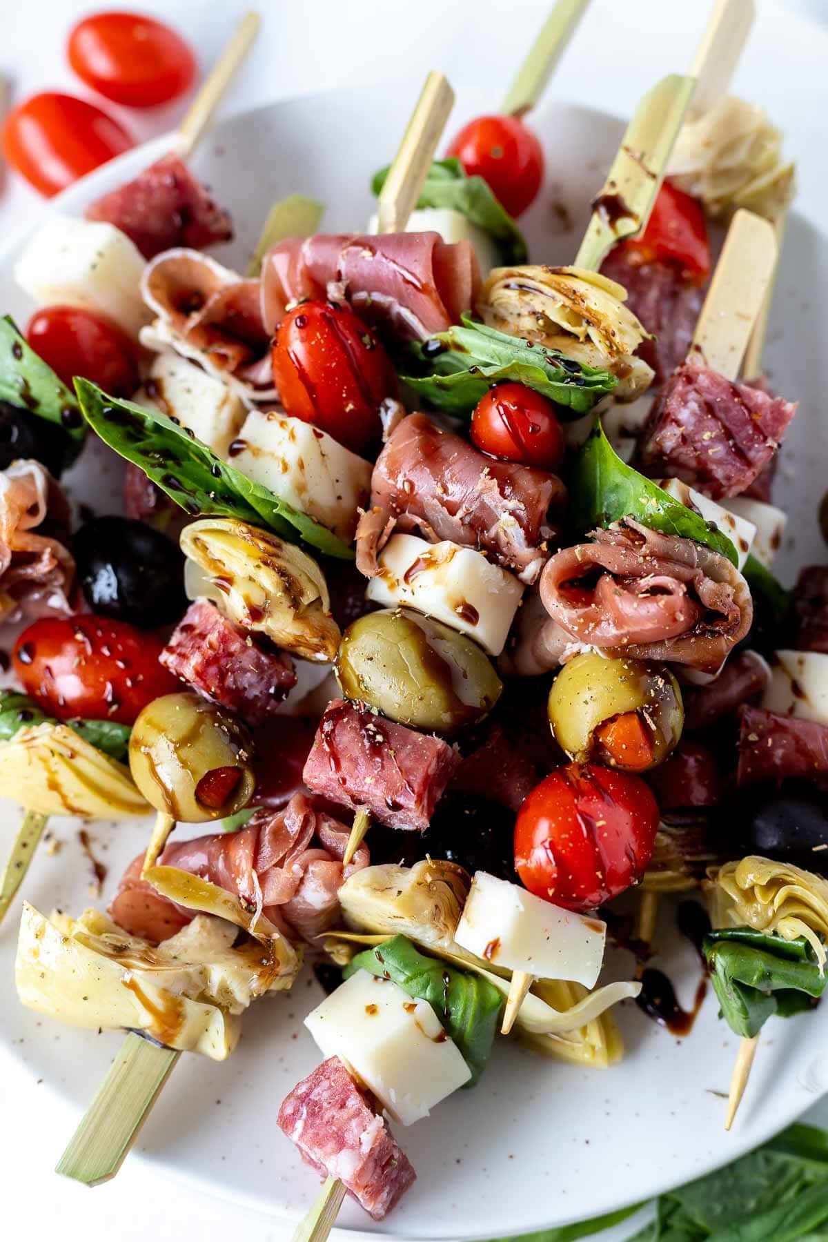 Antipasto skewers with olives, meat, and cheese on stick. 
