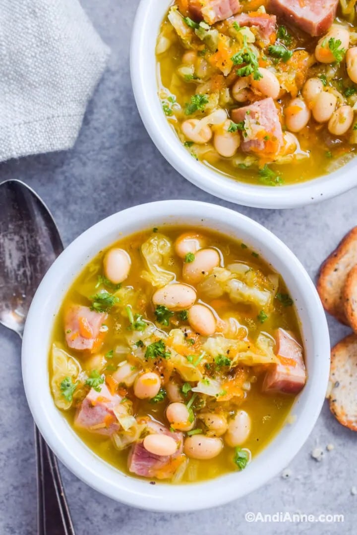 Soup with ham and cabbage served on bowl. 