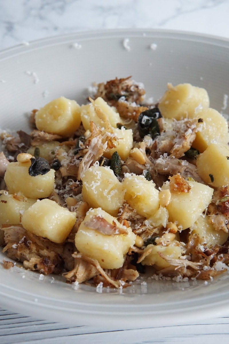 Pulled pork with gnocchi with pine nuts and cheese. 