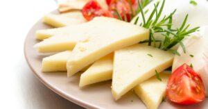 A Plate of Romano Cheese with Tomatoes