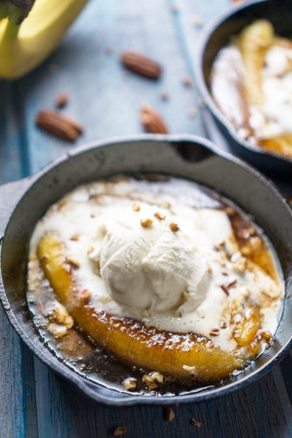 Bananas with caramel rum sauce, and vanilla ice cream on cast iron pan