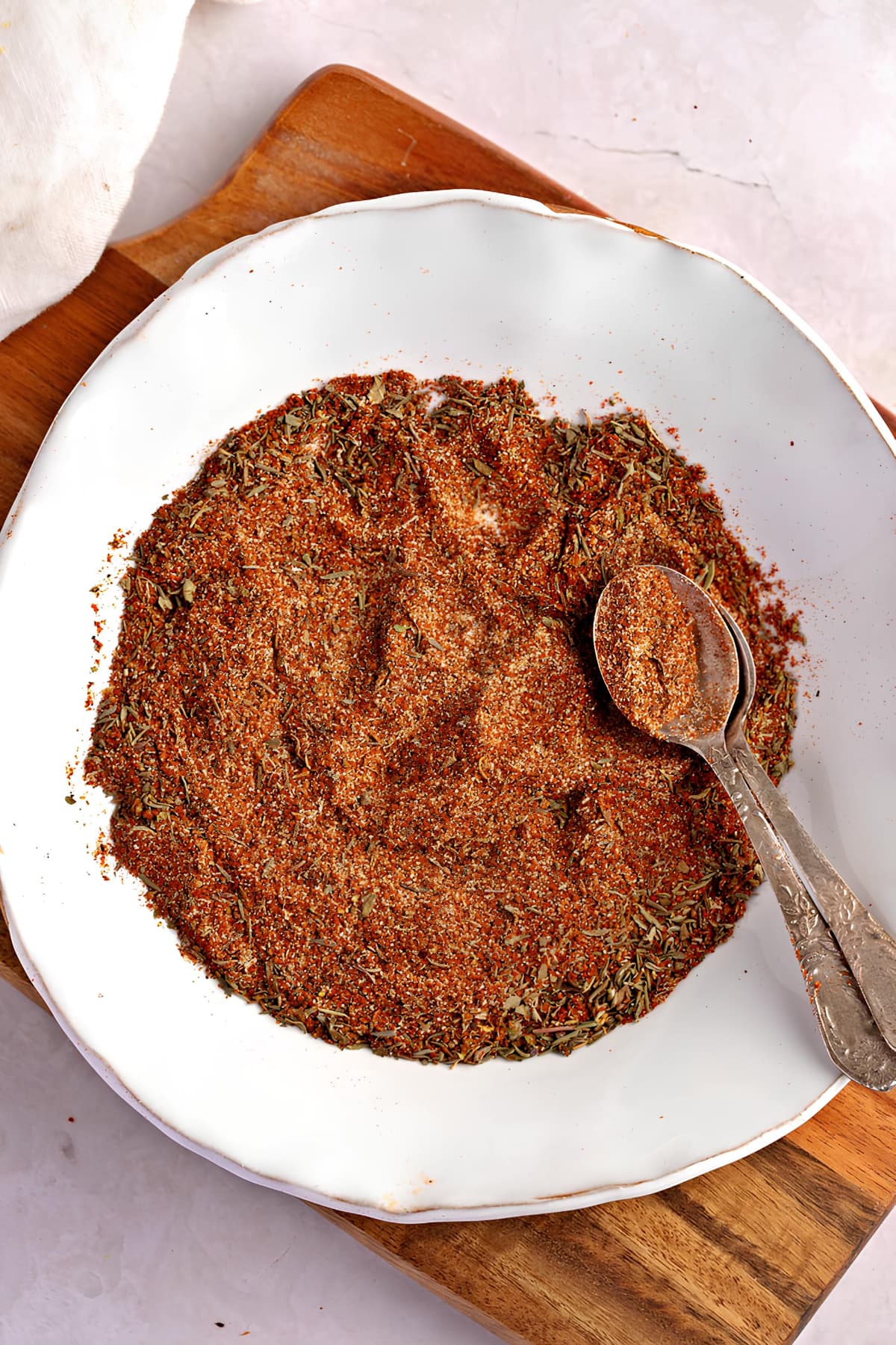 Raw organic blackened seasoning on a white plate