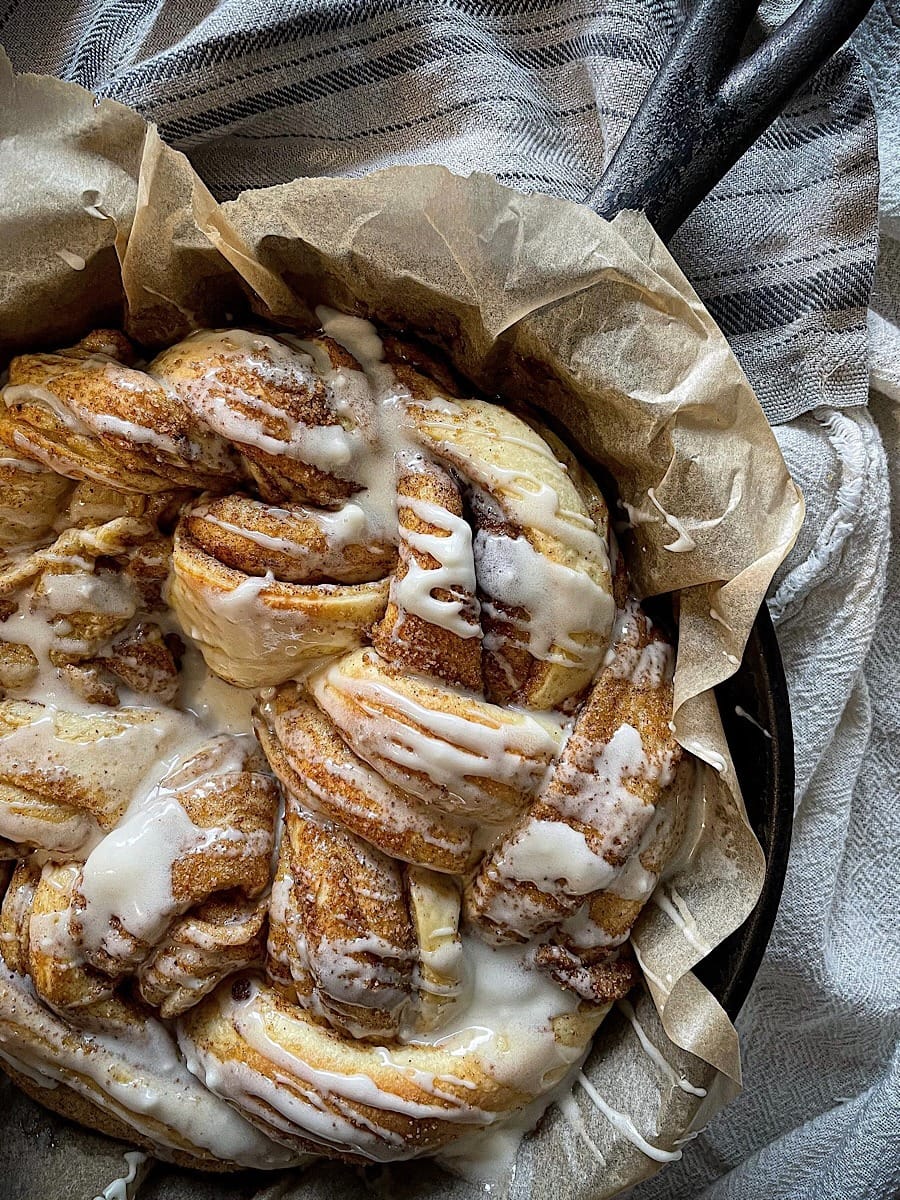 Braided cinnamon sourdough cooked in a skillet. 