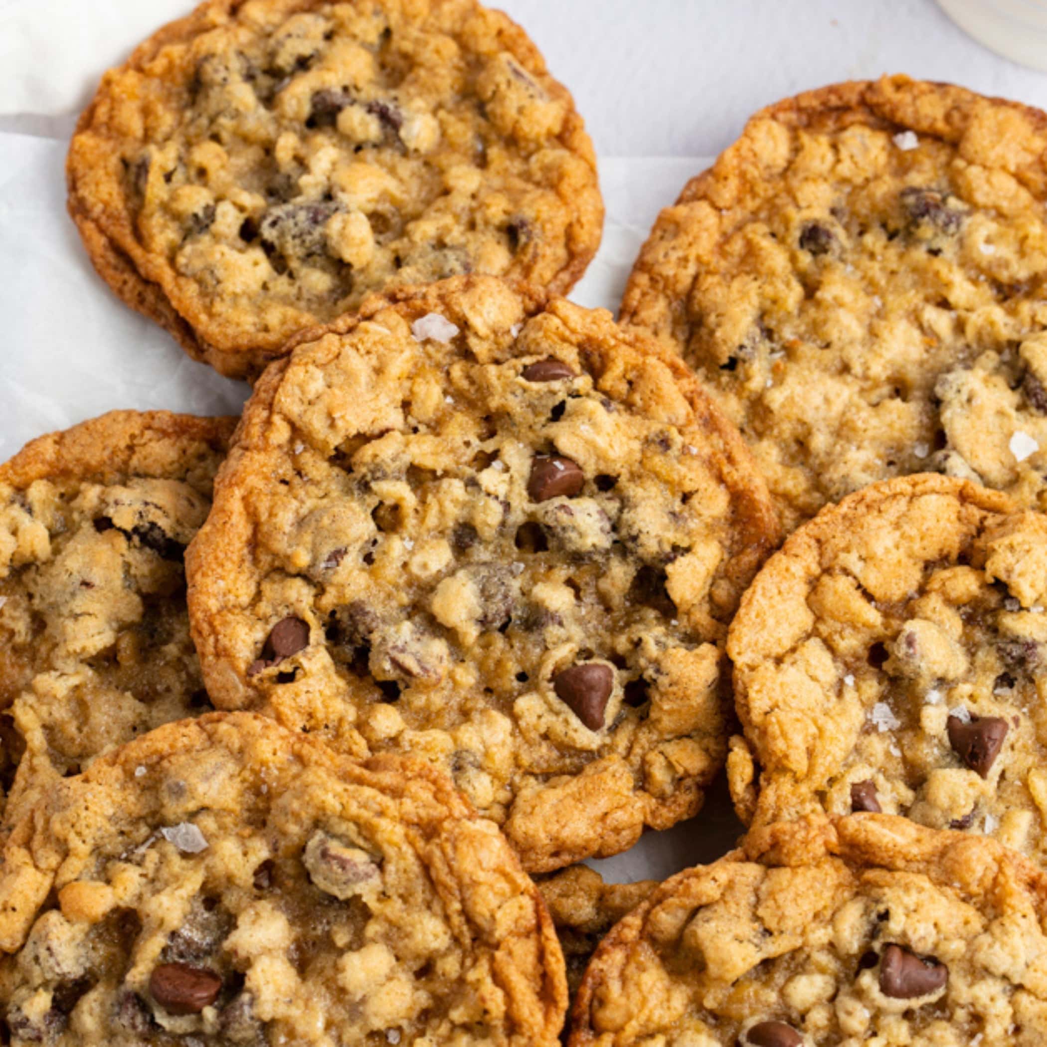 Bunch of Cowboy cookies sprinkled with rock salt. 