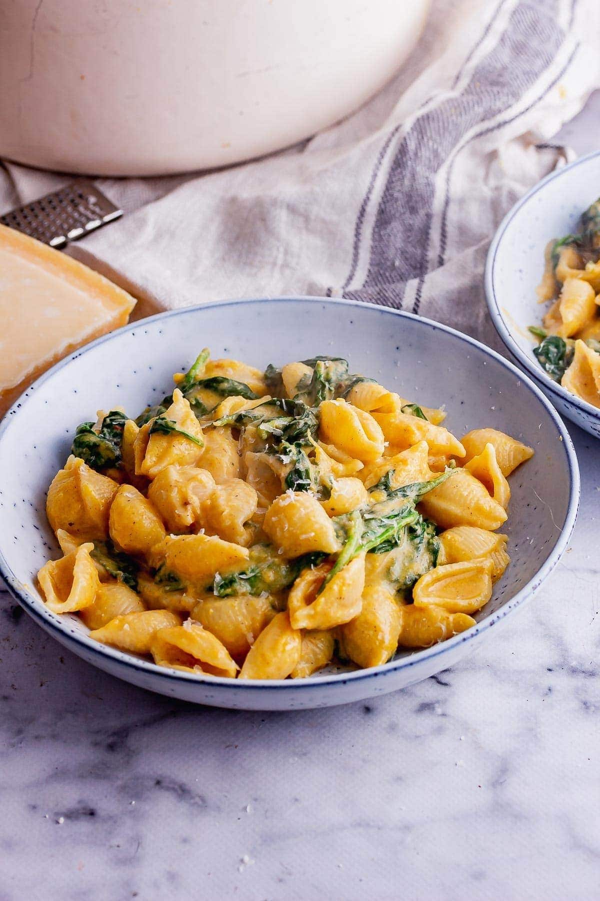 Pasta with butternut squash with cinnamon, nutmeg, and rosemary on a bowl.