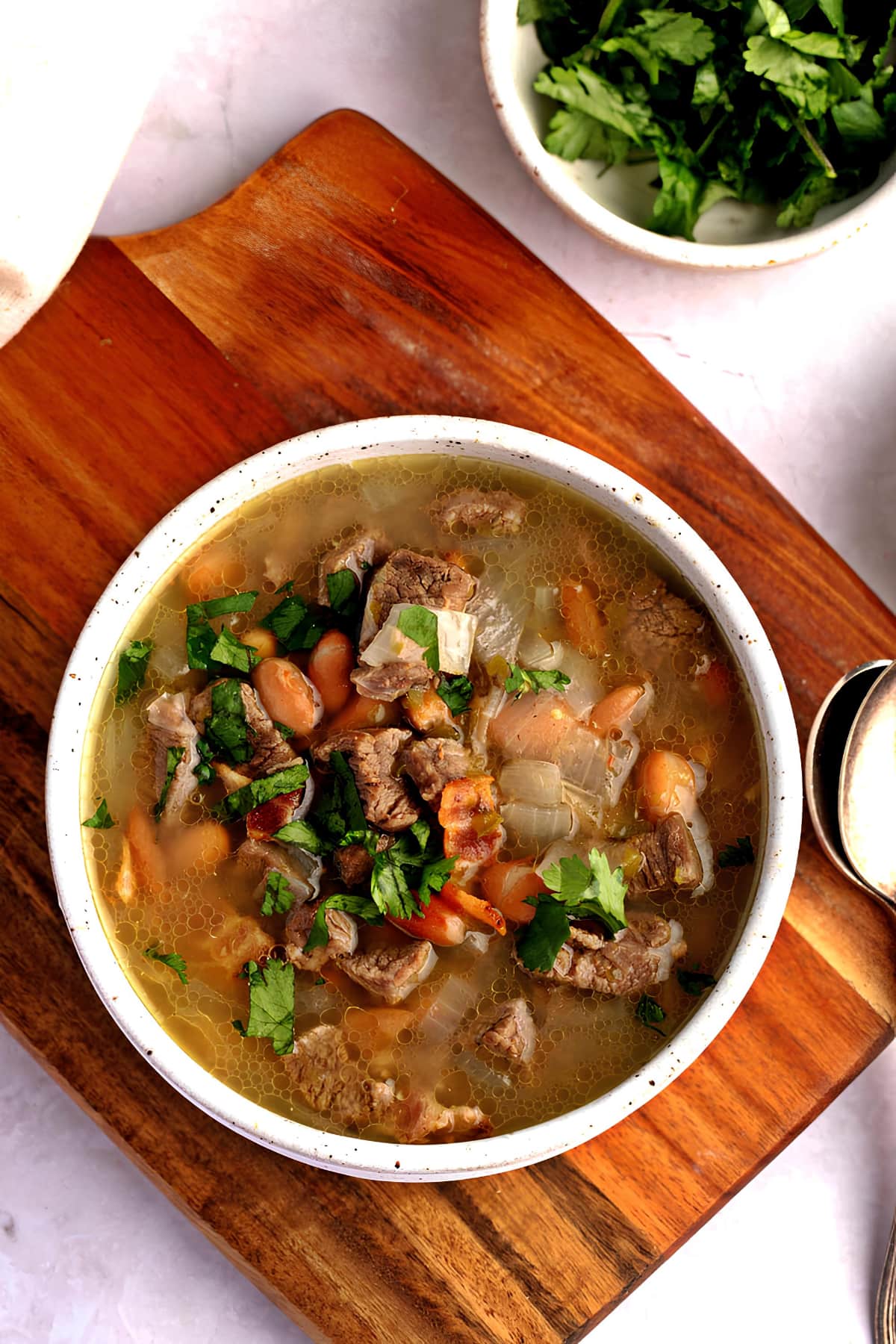 Flank steak soup or Carne En Su Jugo in a Bowl with Vegetables