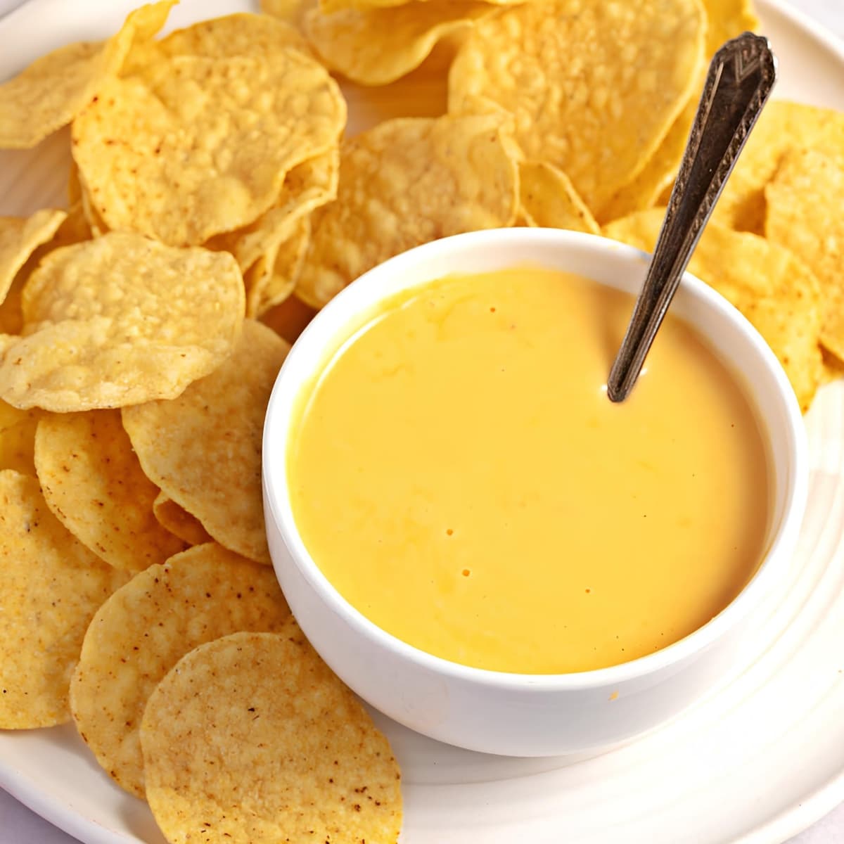 Homemade Creamy Nacho Cheese Sauce Served with Chips