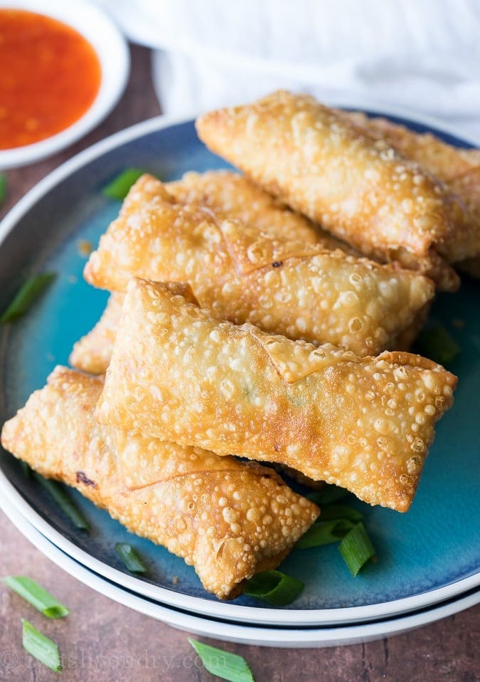 Crispy chicken egg rolls on a plate. 