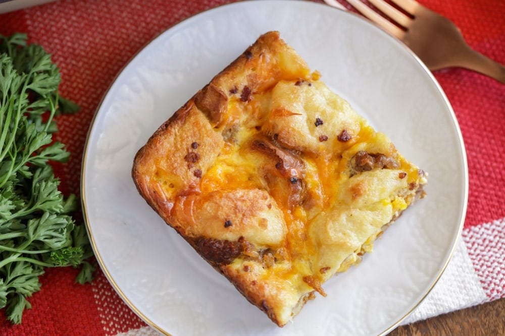 A slice of breakfast casserole on plate.