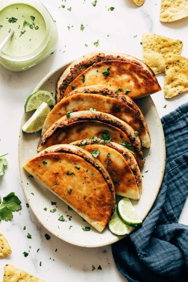 Crispy tacos with black bean filling with fresh salsa.