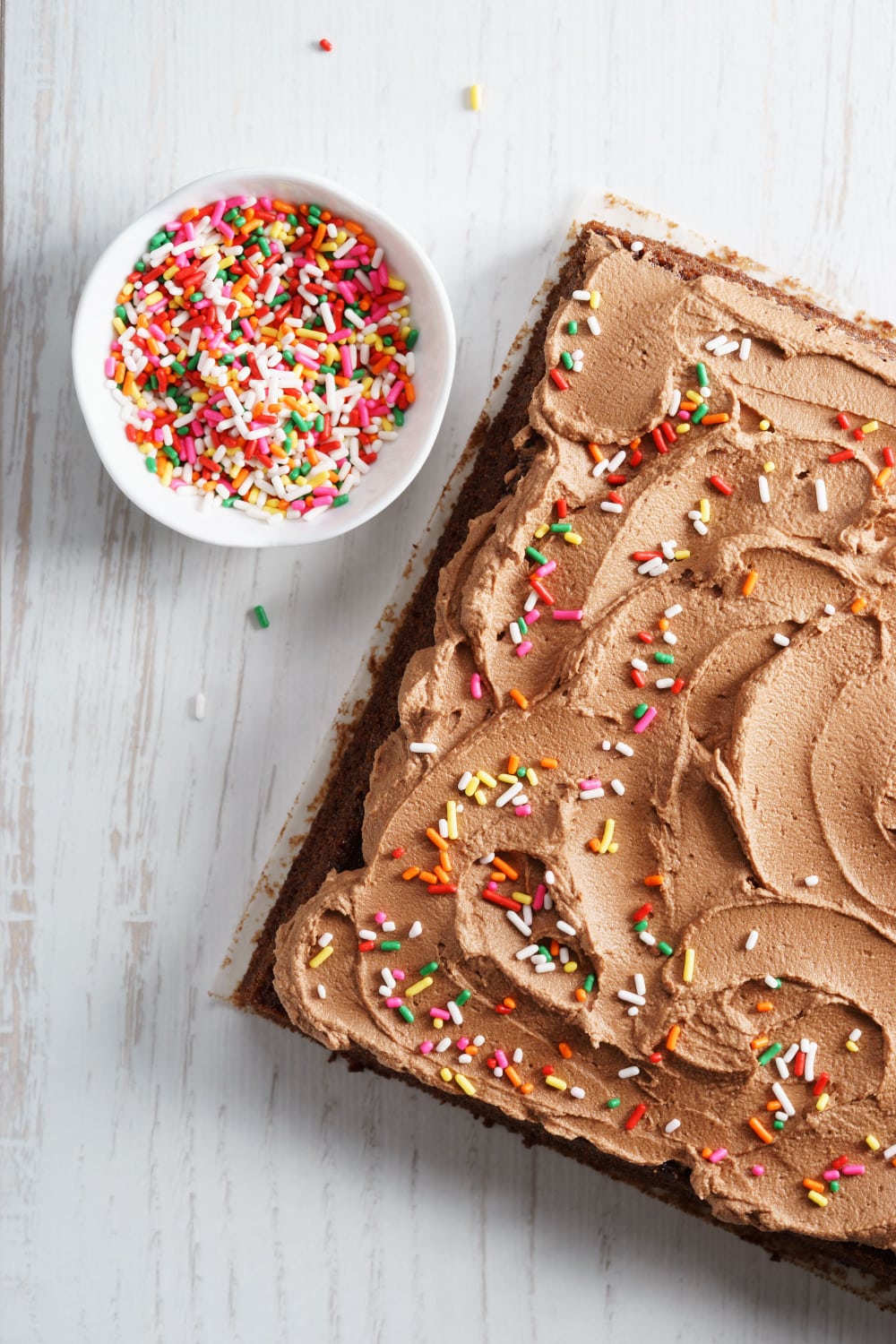 Chocolate Depression Cake (Wacky Cake) with buttercream frosting and colorful sprinkles on top. 