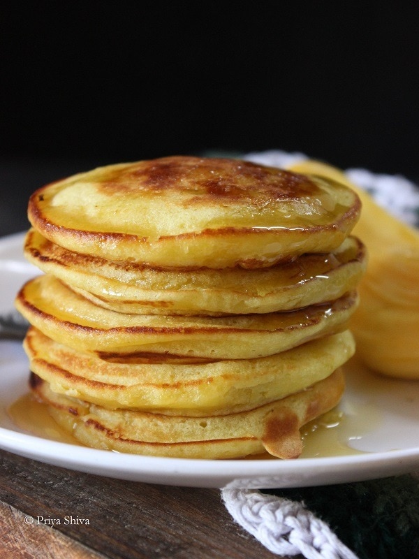 Stack of pancake with dripping syrup.