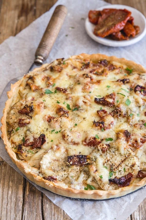 Whole eggplant pie topped with melted parmesan cheese. 