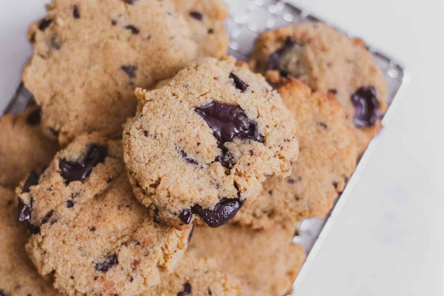 Bunch of Espresso chocolate chip cookies on a wooden board. 