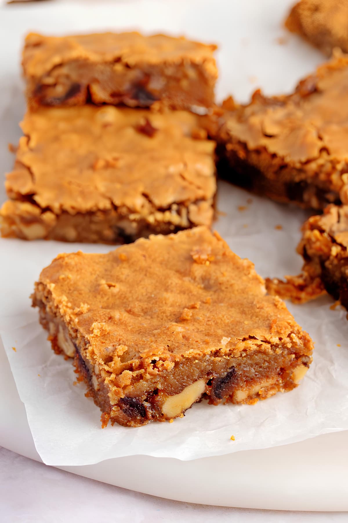 Food for the Gods Recipe (Filipino Dessert) featuring blondie butterscotch Food for the Gods bar filled with dates and walnuts served on a plate. 