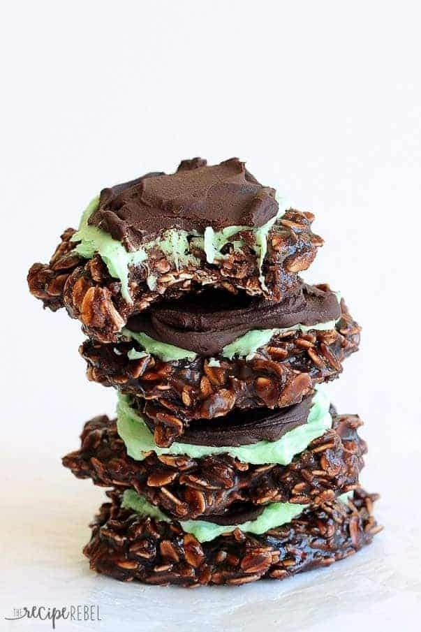Stack of chocolate oatmeal cookies topped with mint buttercream and a chocolate ganache,