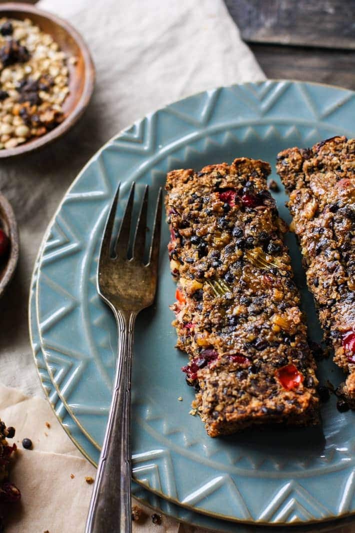 Sliced cranberry lentil meatloaf on a plate. 