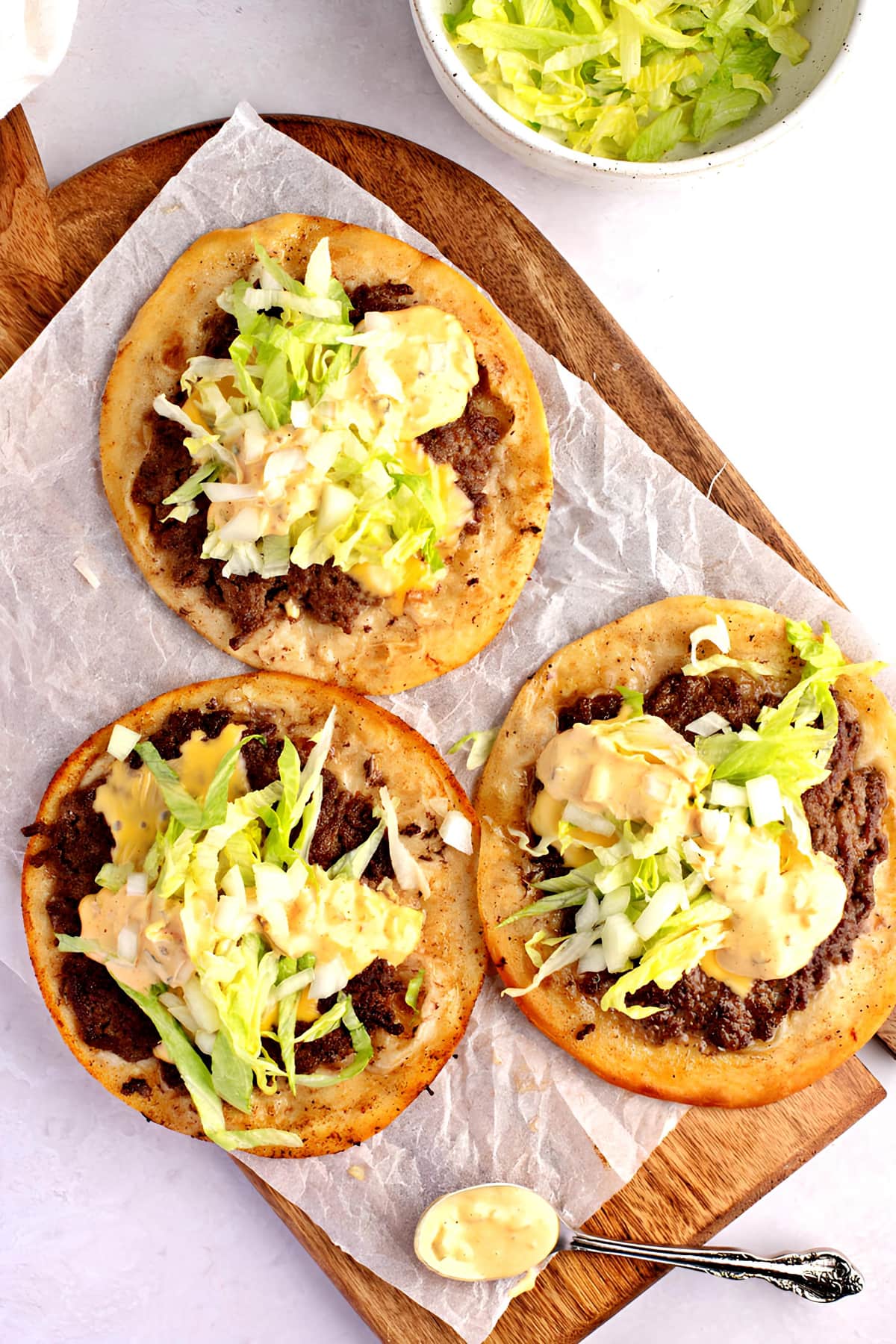 Three smash burger taco with tortillas, iceberg lettuce, special sauce and ground round patty