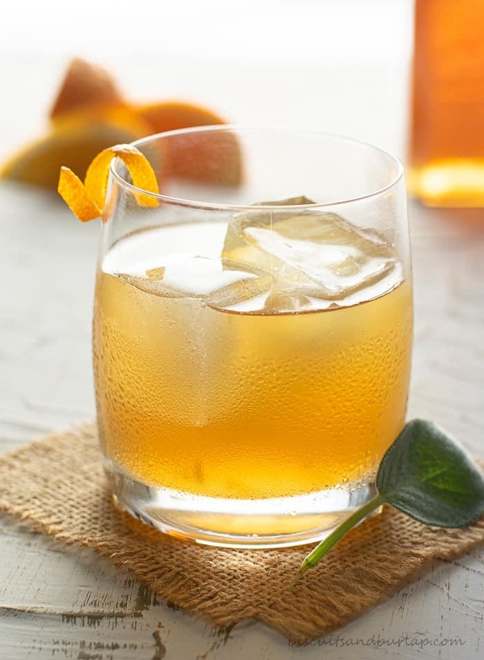 Iced cold honey bourbon cocktail in glass.